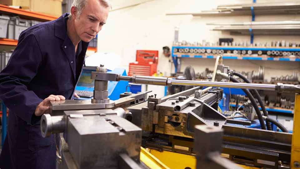 Business Owner inspecting the manufacturing tools to have a better understanding on how to strategize the manufacturing cost