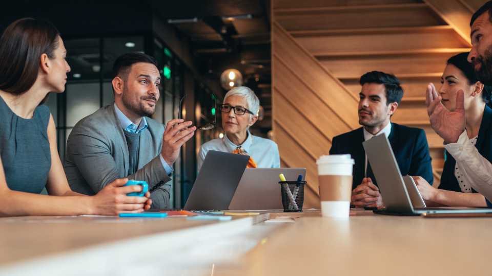 Business employee having a meeting on a conference room around a table